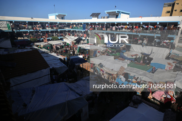 Displaced Palestinians are taking shelter in a UNRWA-affiliated Deir al-Balah school after fleeing their homes due to Israeli strikes, amid...