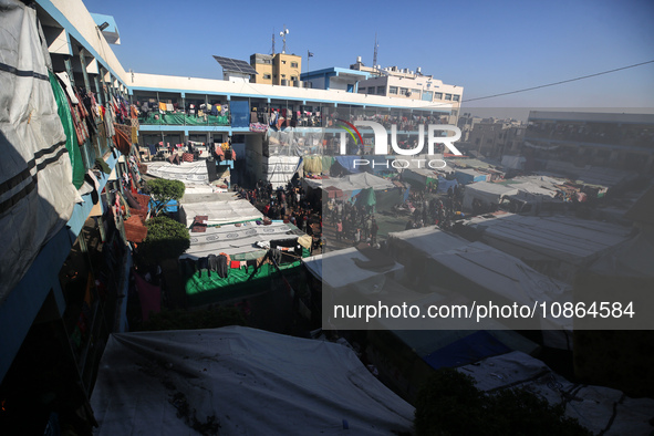 Displaced Palestinians are taking shelter in a UNRWA-affiliated Deir al-Balah school after fleeing their homes due to Israeli strikes, amid...