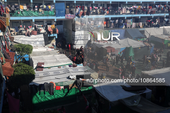 Displaced Palestinians are taking shelter in a UNRWA-affiliated Deir al-Balah school after fleeing their homes due to Israeli strikes, amid...