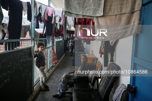 Displaced Palestinians are taking shelter in a UNRWA-affiliated Deir al-Balah school after fleeing their homes due to Israeli strikes, amid...