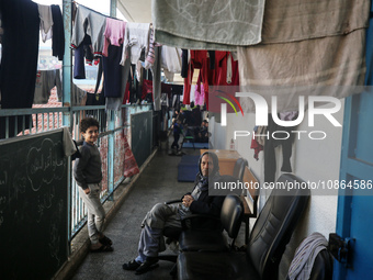 Displaced Palestinians are taking shelter in a UNRWA-affiliated Deir al-Balah school after fleeing their homes due to Israeli strikes, amid...