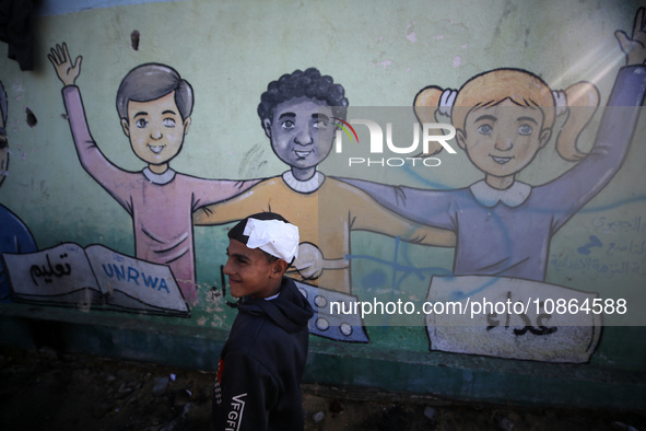 Displaced Palestinians are taking shelter in a UNRWA-affiliated Deir al-Balah school after fleeing their homes due to Israeli strikes, amid...