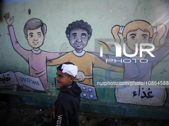 Displaced Palestinians are taking shelter in a UNRWA-affiliated Deir al-Balah school after fleeing their homes due to Israeli strikes, amid...