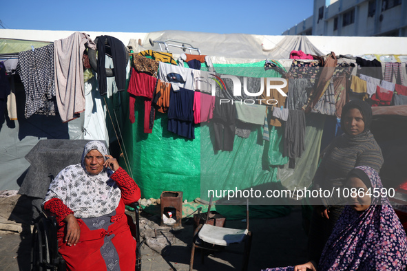 Displaced Palestinians are taking shelter in a UNRWA-affiliated Deir al-Balah school after fleeing their homes due to Israeli strikes, amid...