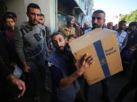 Displaced Palestinians are taking shelter in a UNRWA-affiliated Deir al-Balah school after fleeing their homes due to Israeli strikes, amid...