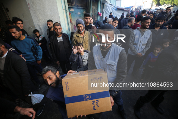 Displaced Palestinians are taking shelter in a UNRWA-affiliated Deir al-Balah school after fleeing their homes due to Israeli strikes, amid...