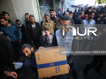 Displaced Palestinians are taking shelter in a UNRWA-affiliated Deir al-Balah school after fleeing their homes due to Israeli strikes, amid...