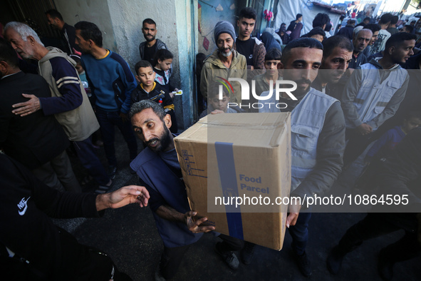 Displaced Palestinians are taking shelter in a UNRWA-affiliated Deir al-Balah school after fleeing their homes due to Israeli strikes, amid...