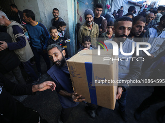 Displaced Palestinians are taking shelter in a UNRWA-affiliated Deir al-Balah school after fleeing their homes due to Israeli strikes, amid...