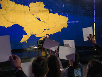 President Volodymyr Zelenskiy of Ukraine is answering questions from journalists during a large summary press conference in Kyiv, Ukraine, o...