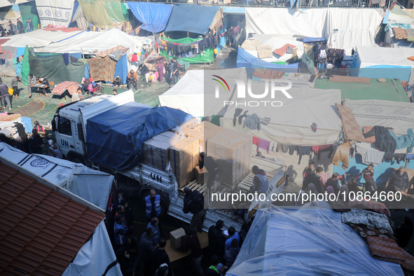 Displaced Palestinians are taking shelter in a UNRWA-affiliated Deir al-Balah school after fleeing their homes due to Israeli strikes, amid...