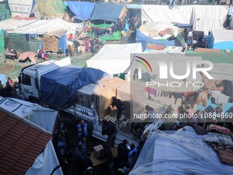 Displaced Palestinians are taking shelter in a UNRWA-affiliated Deir al-Balah school after fleeing their homes due to Israeli strikes, amid...