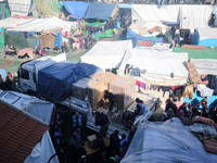 Displaced Palestinians are taking shelter in a UNRWA-affiliated Deir al-Balah school after fleeing their homes due to Israeli strikes, amid...