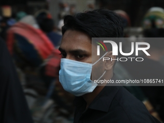 People are wearing protective masks in Dhaka, Bangladesh, on December 20, 2023, as a new Covid variant has been found in Kerala, India. (