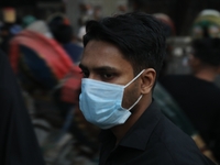 People are wearing protective masks in Dhaka, Bangladesh, on December 20, 2023, as a new Covid variant has been found in Kerala, India. (