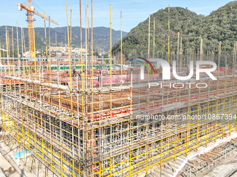 Workers are braving the cold at the construction site of the second phase of the Fuxi Street project in Moganshan town, Deqing County, Huzho...