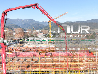 Workers are braving the cold at the construction site of the second phase of the Fuxi Street project in Moganshan town, Deqing County, Huzho...