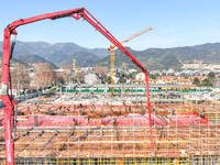 Workers are braving the cold at the construction site of the second phase of the Fuxi Street project in Moganshan town, Deqing County, Huzho...