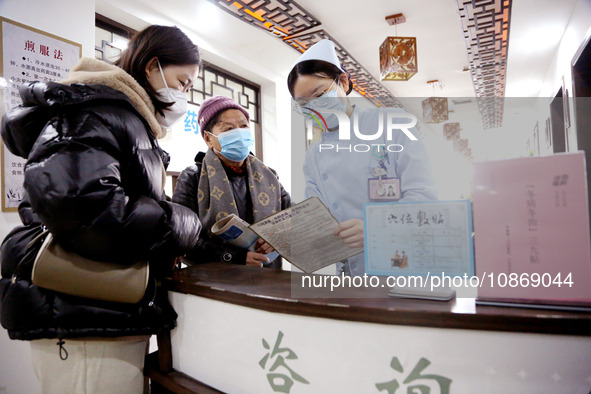 People are posting ''Sanjiu stickers'' at the Traditional Chinese Medicine Hall of Oriental Hospital in Lianyungang, East China's Jiangsu pr...