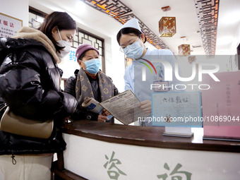 People are posting ''Sanjiu stickers'' at the Traditional Chinese Medicine Hall of Oriental Hospital in Lianyungang, East China's Jiangsu pr...