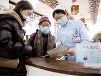 People are posting ''Sanjiu stickers'' at the Traditional Chinese Medicine Hall of Oriental Hospital in Lianyungang, East China's Jiangsu pr...