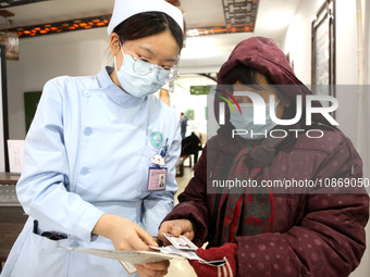 People are posting ''Sanjiu stickers'' at the Traditional Chinese Medicine Hall of Oriental Hospital in Lianyungang, East China's Jiangsu pr...