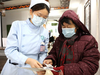 People are posting ''Sanjiu stickers'' at the Traditional Chinese Medicine Hall of Oriental Hospital in Lianyungang, East China's Jiangsu pr...