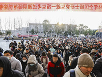 Candidates for the master's degree entrance examination are lining up to enter the test center at Huaiyin Normal University in Huai'an, Chin...