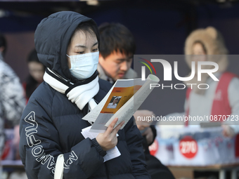 Candidates for the master's degree entrance examination are lining up to enter the test center at Huaiyin Normal University in Huai'an, Chin...