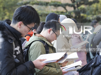 Candidates for the master's degree entrance examination are lining up to enter the test center at Huaiyin Normal University in Huai'an, Chin...