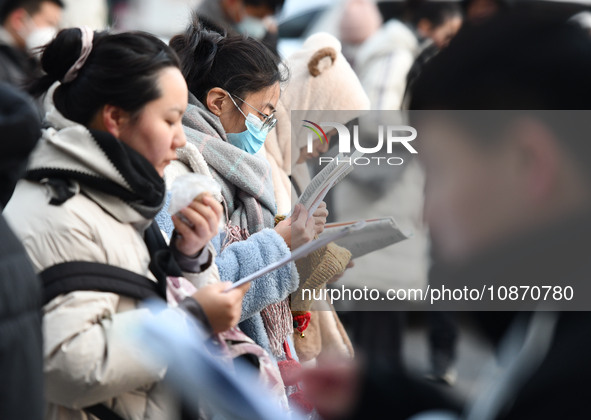 Candidates are preparing to enter the entrance exam for postgraduate students at the No. 15 Middle School exam center in Fuyang, China, on D...