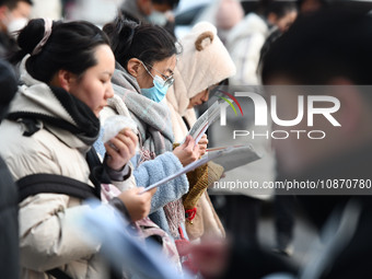 Candidates are preparing to enter the entrance exam for postgraduate students at the No. 15 Middle School exam center in Fuyang, China, on D...