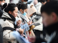 Candidates are preparing to enter the entrance exam for postgraduate students at the No. 15 Middle School exam center in Fuyang, China, on D...