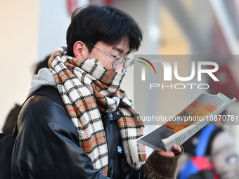 Candidates are preparing to enter the entrance exam for postgraduate students at the No. 15 Middle School exam center in Fuyang, China, on D...