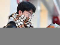 Candidates are preparing to enter the entrance exam for postgraduate students at the No. 15 Middle School exam center in Fuyang, China, on D...