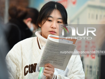 Candidates are preparing to enter the entrance exam for postgraduate students at the No. 15 Middle School exam center in Fuyang, China, on D...