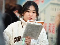 Candidates are preparing to enter the entrance exam for postgraduate students at the No. 15 Middle School exam center in Fuyang, China, on D...