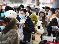 Candidates are preparing to enter the entrance exam for postgraduate students at the No. 15 Middle School exam center in Fuyang, China, on D...