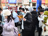 Candidates are preparing to enter the entrance exam for postgraduate students at the No. 15 Middle School exam center in Fuyang, China, on D...