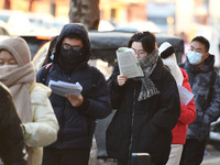 Candidates are preparing to enter the entrance exam for postgraduate students at the No. 15 Middle School exam center in Fuyang, China, on D...