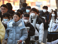 Candidates are preparing to enter the entrance exam for postgraduate students at the No. 15 Middle School exam center in Fuyang, China, on D...