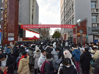 Candidates are preparing to enter the entrance exam for postgraduate students at the No. 15 Middle School exam center in Fuyang, China, on D...