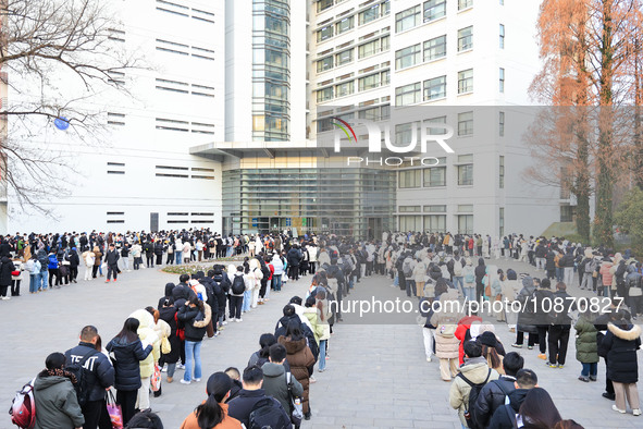 Candidates are preparing for the 2024 national postgraduate entrance examination at the test center of Nanjing Forestry University in Nanjin...