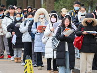 Candidates are preparing for the 2024 national postgraduate entrance examination at the test center of Nanjing Forestry University in Nanjin...