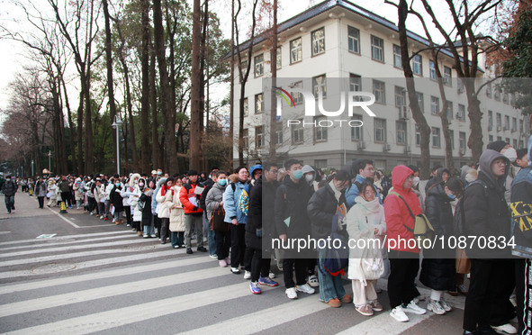 Candidates are preparing for the 2024 national postgraduate entrance examination at the test center of Nanjing Forestry University in Nanjin...