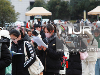 Candidates are preparing for the 2024 national postgraduate entrance examination at the test center of Nanjing Forestry University in Nanjin...