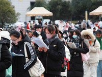 Candidates are preparing for the 2024 national postgraduate entrance examination at the test center of Nanjing Forestry University in Nanjin...