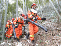 Forest firefighters are conducting a fire prevention and emergency response drill in Dayao village, Moganshan town, Huzhou city, Zhejiang pr...