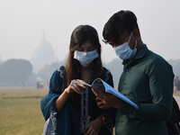 People are wearing protective masks in Kolkata, India, on December 23, 2023. (