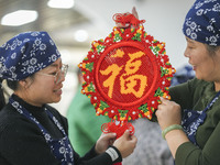 Students are learning to knit Chinese knots at a vocational training school on Dexi Street in Zouping, China, on December 25, 2023. (